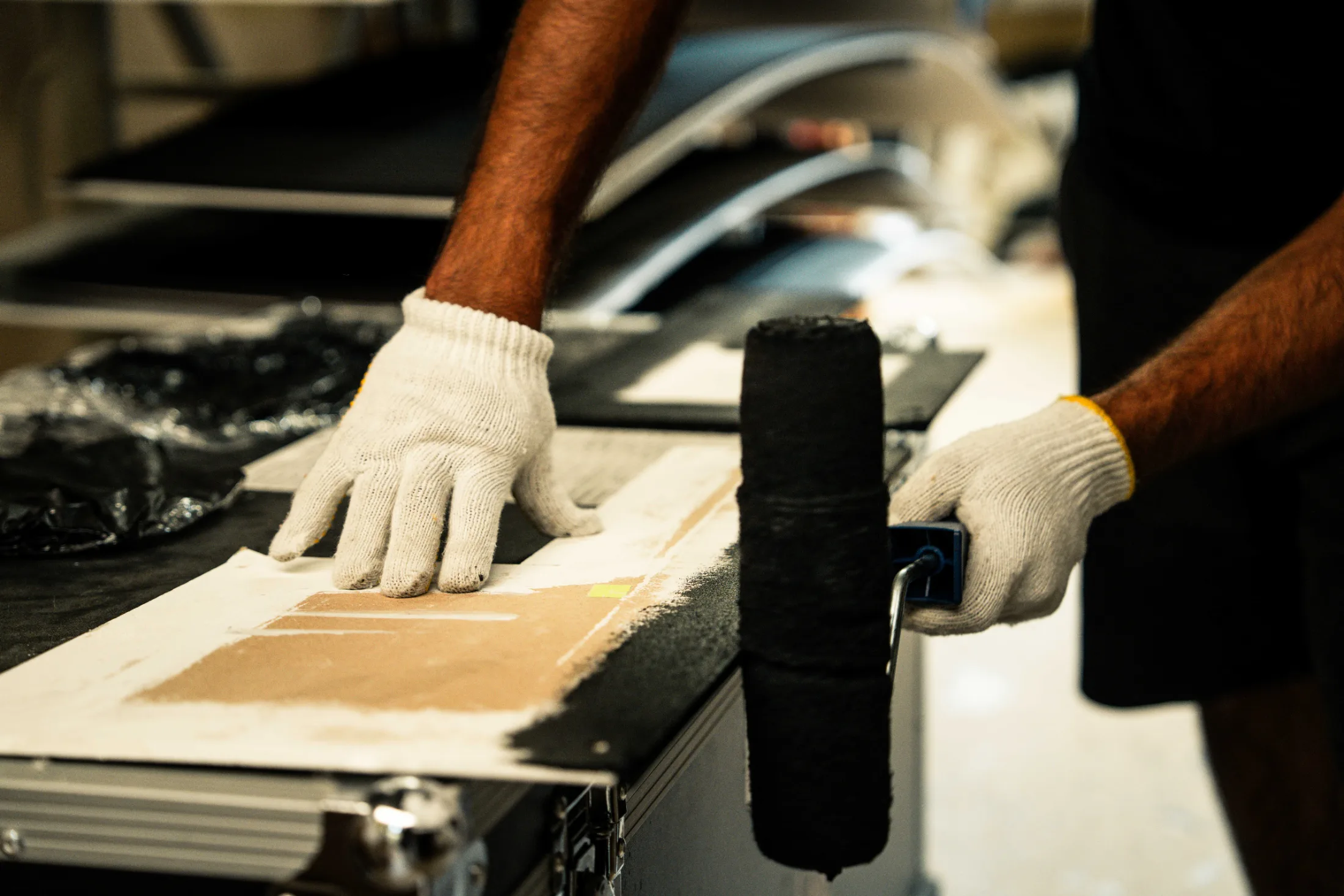 Applying a printed graphic to a board with a hand roller
