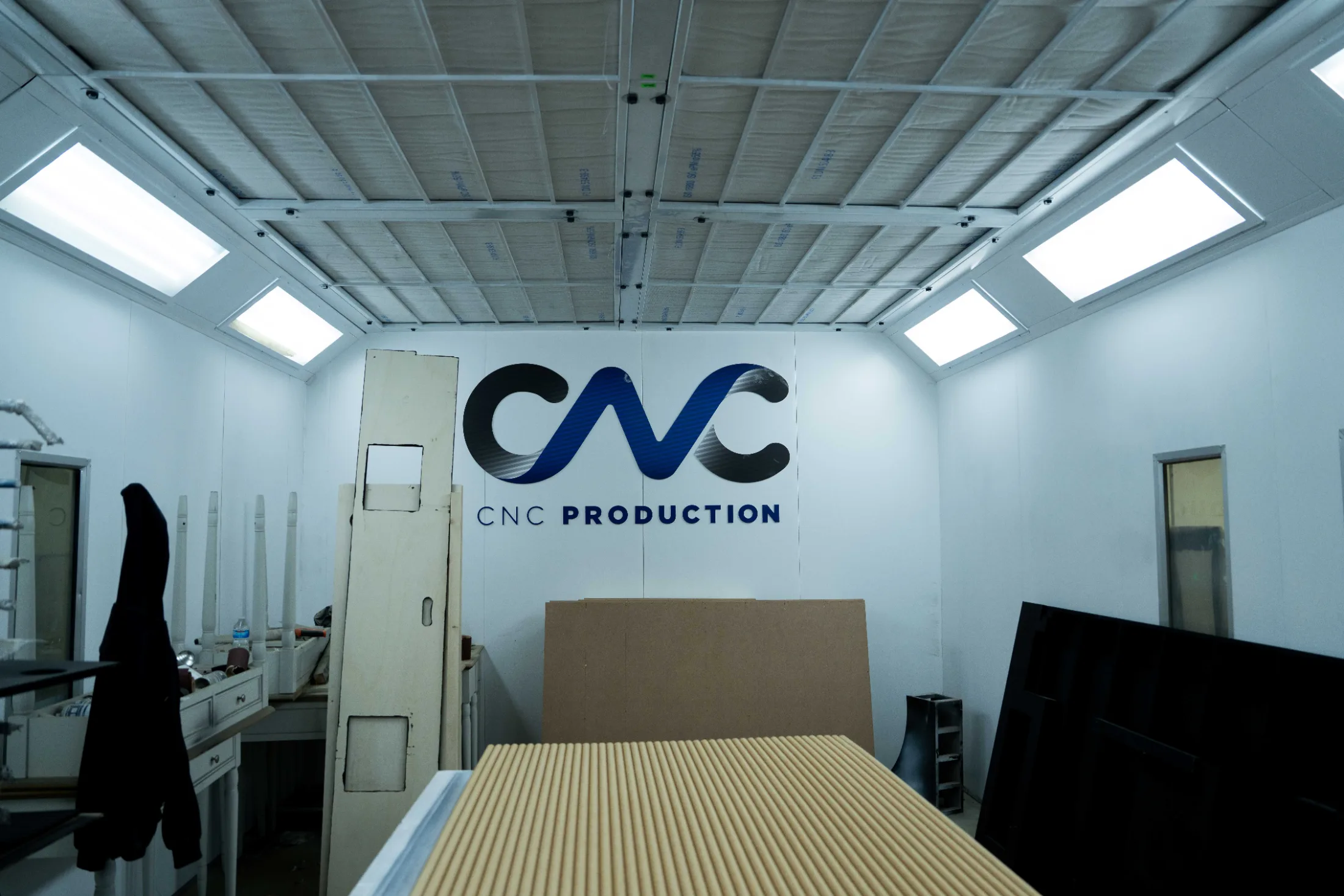 CNC Production spray booth interior with a primed panel ready to finish