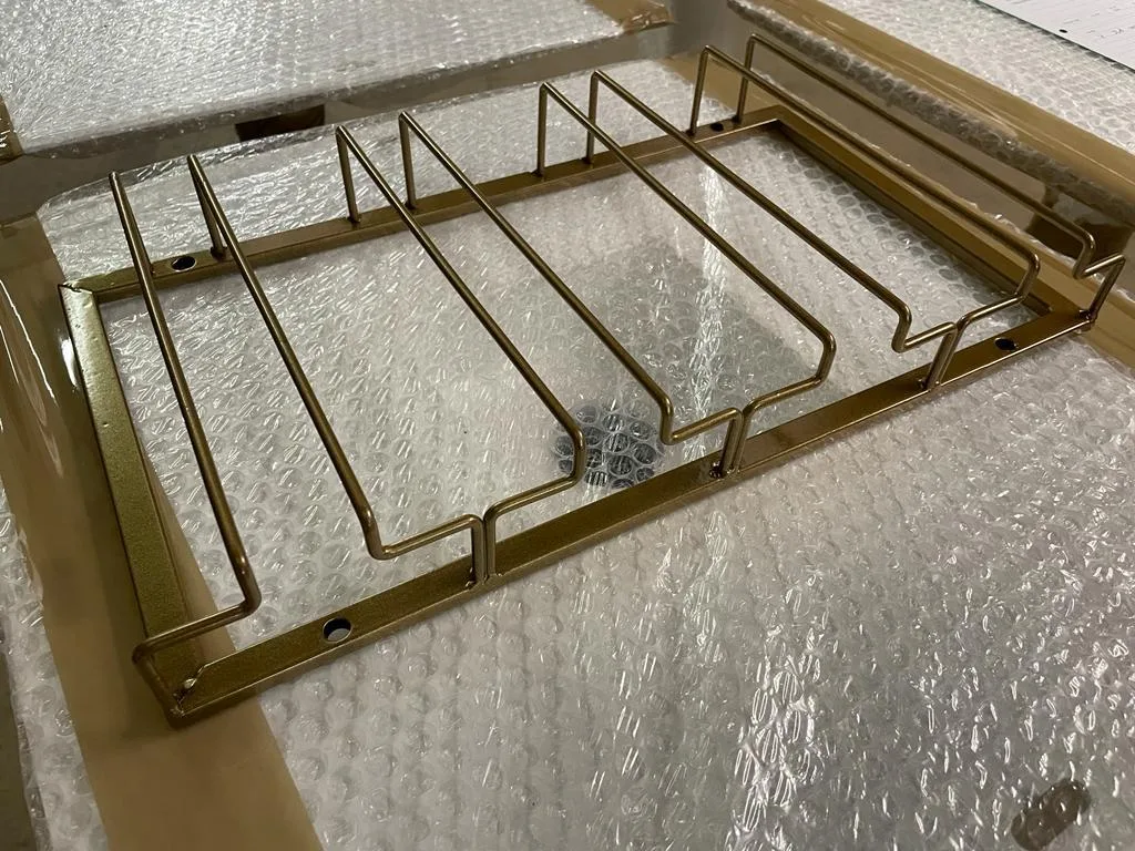 Brass glass rack frames finished and wrapped for delivery in the CNC Production workshop