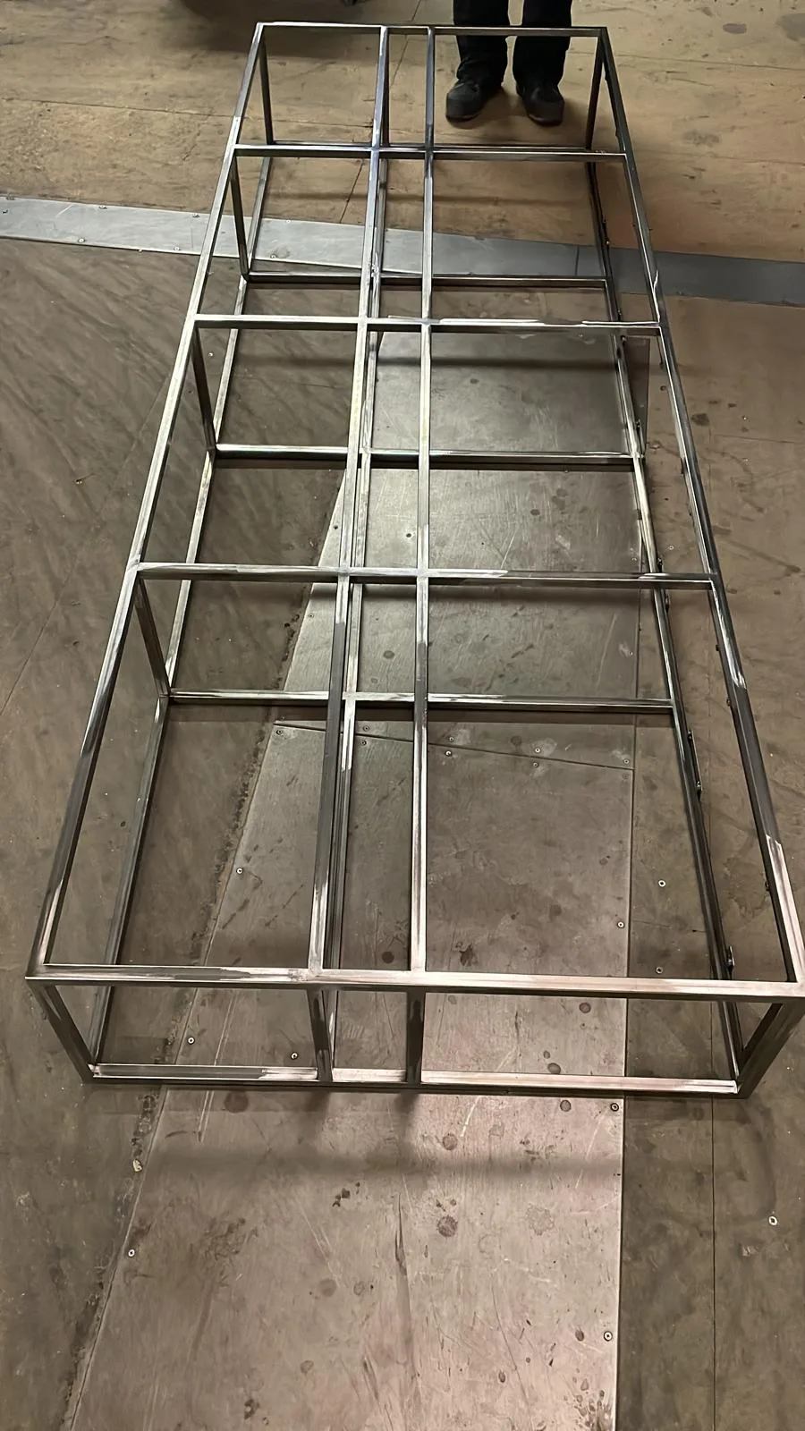 Stainless steel welded frame structure on the CNC Production workshop floor